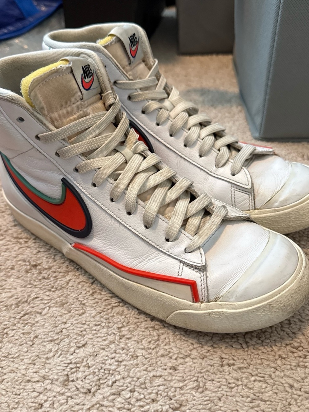 Nike ’s White High-Top Sneakers with Orange Swoosh